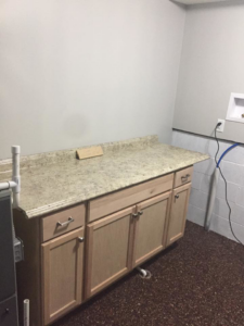 New utility room cabinets and countertop installed by Kline Custom Homes and Remodelers in Canton, OH.
