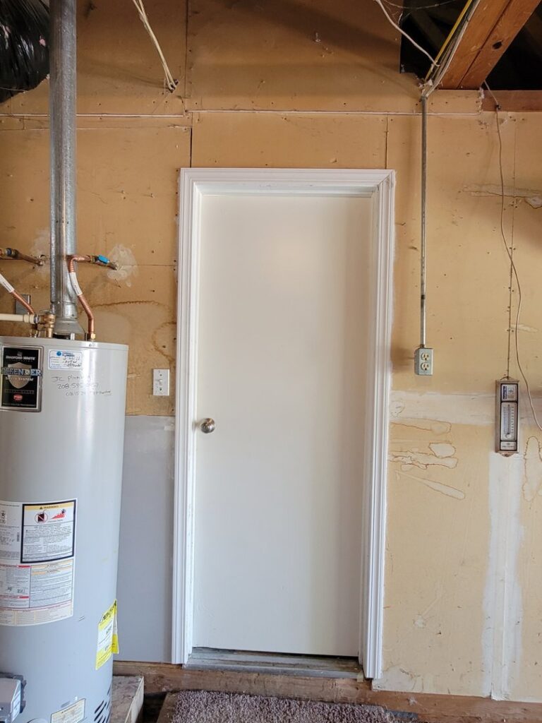 Utility room door installation next to a water heater by Max Maintenance in Twin Falls, ID.