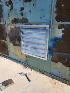 A new vent installed in a metal wall, a service provided by Joe's Handyman Solutions in Ogden, UT.