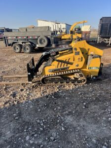 A Vermeer S925TX mini skid steer with forks, used by A. Matt Tree Service for material handling in Fort Worth, TX.
