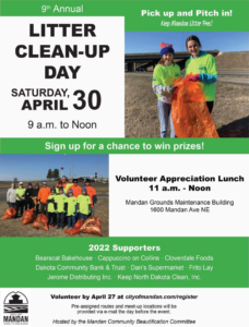 Volunteers collecting litter in orange bags during a clean-up event for North Dakota Solid Waste Recycling Association in Bismarck, ND.