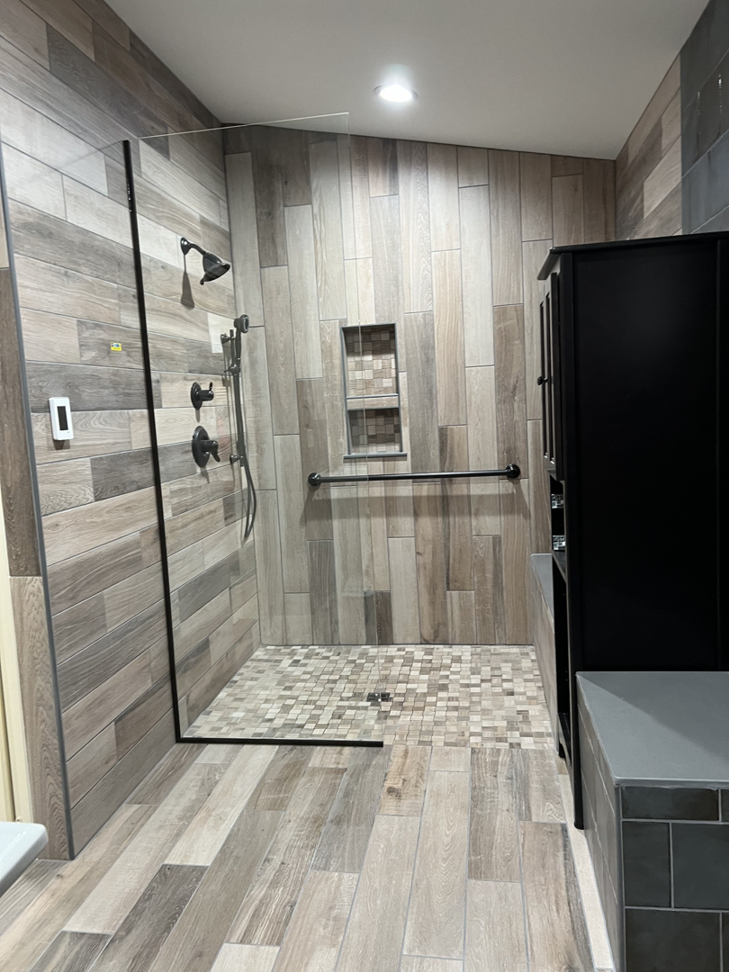 A completed walk-in shower as part of a bathroom remodel by Lafayette Concrete & Remodel, LLC in Lafayette, IN