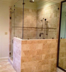 Professional walk-in shower installation with glass enclosure and tiling by Bernhard Normand Construction in Baton Rouge, LA.
