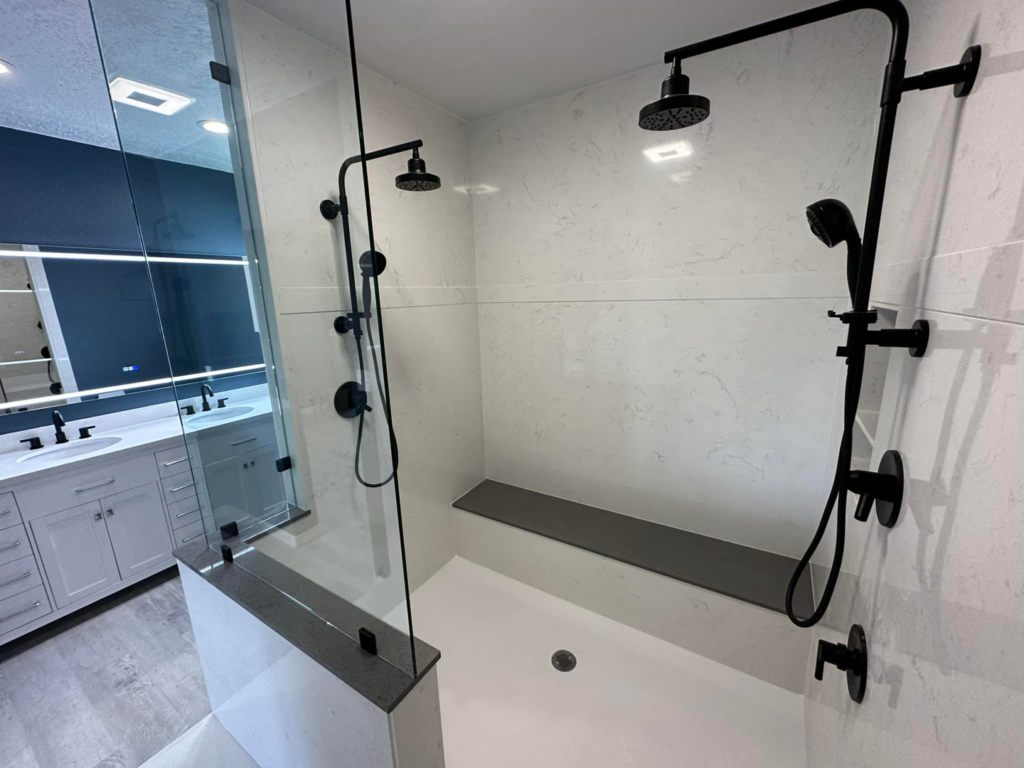 Detailed view of a modern walk-in shower installation during a bathroom remodel by DSM Construction in Evanston, WY.