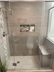 Beautiful walk-in shower installation with tiled walls and bench by Top Notch Contracting in Racine, WI.