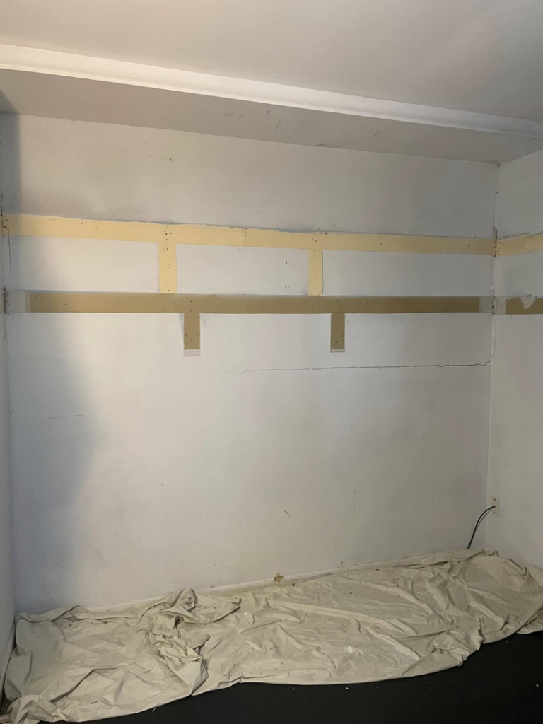 Interior wall with wooden framing and blocking installed, showing work in progress by Wareham Home Improvements in Frederick, MD.