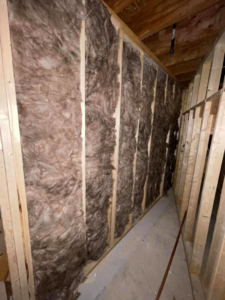 Wall insulation being installed in a framed building by Miami Valley Insulation Co LLC, serving Dayton, OH.