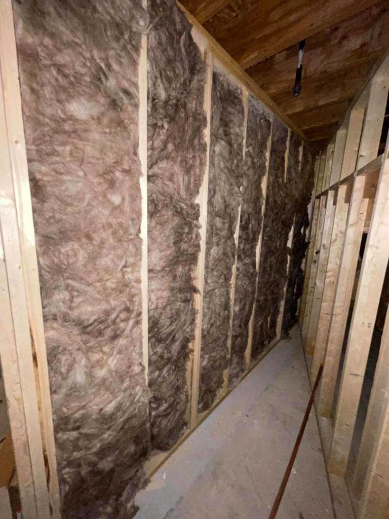 Wall insulation being installed in a framed building by Miami Valley Insulation Co LLC, serving Dayton, OH.