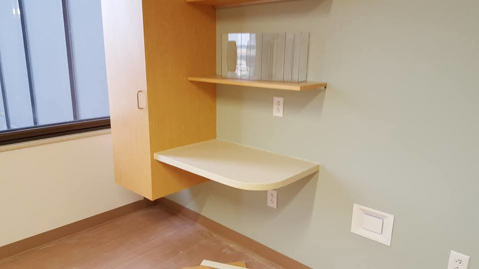 Wall-mounted cabinet, shelves, and desk installation by Zubieta Kitchen & Bath LLC in Augusta, GA.