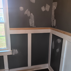 Wall preparation for painting, showing wainscoting and spackle spots, by Carter's painting in Martinsburg, WV.