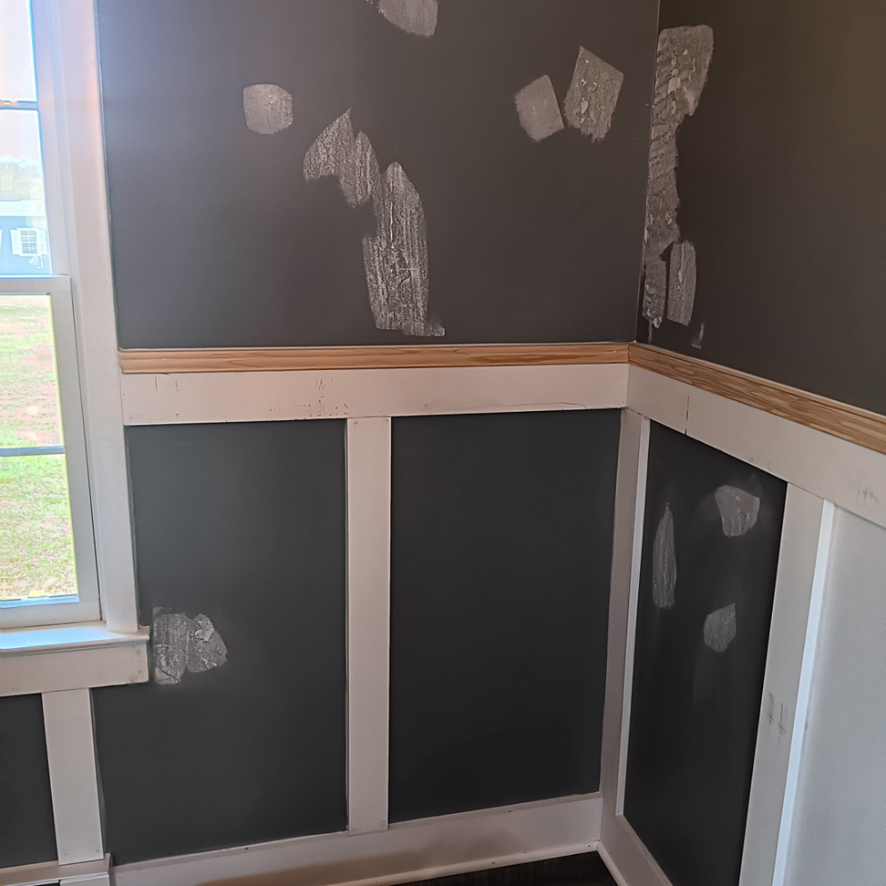 Wall preparation for painting, showing wainscoting and spackle spots, by Carter's painting in Martinsburg, WV.