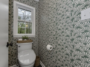 Stylish patterned wallpaper installed in a powder room, a professional service offered by Boyd's Custom Building in Charlotte, NC.