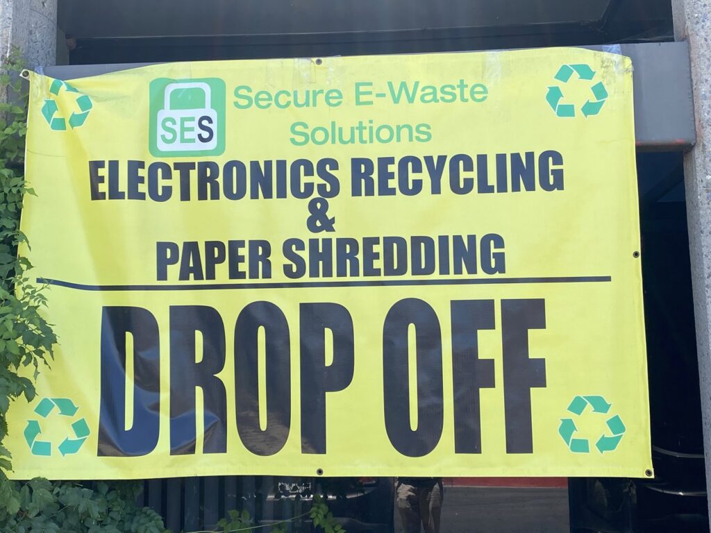 Warehouse storage area with large cardboard boxes for sorting and holding e-waste at SES Secure E-Waste Solutions Inc. in San Diego, CA.