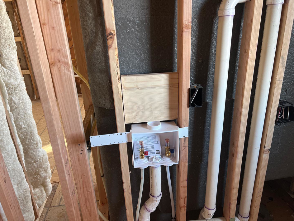 A washing machine plumbing rough-in box installed in a framed wall by Kliesen Construction Company in Pueblo, CO.