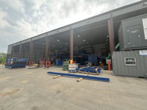 An expansive waste processing facility with machinery inside and outside for CARDS - City of Springdale in Springdale, AR