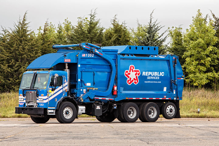 The entrance to a waste transfer station, showing signs for vehicle inspection, relevant to Benjamin's Rural Disposal services in Meridian, ID.