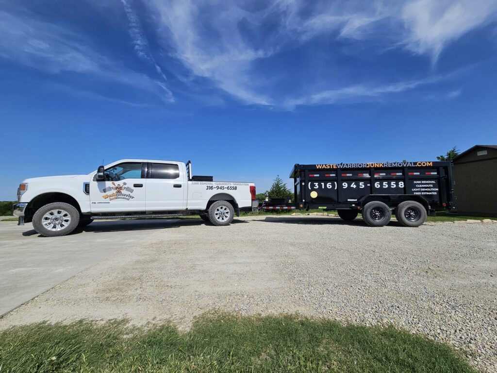A Waste Warrior branded truck pulling a dump trailer with junk removal services listed in Wichita, KS.