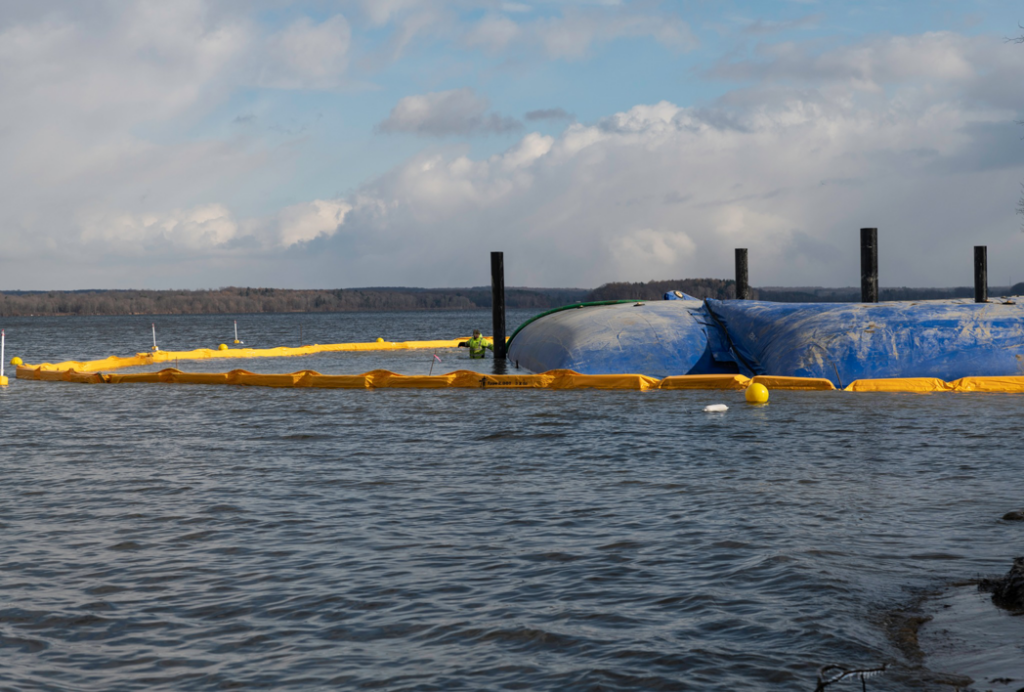 Water-side view of shoreline protection barriers and boom by Wilkinson Excavating, Inc. in Meadville, PA