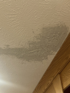 A water stain on a textured ceiling, indicating a repair job by Katzenstein llc handyman in Council Bluffs, IA.