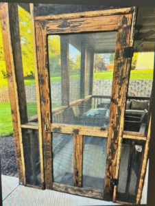 A weathered wooden screen door, showing the need for restoration services from CParks Pressure Washing and Deck Restoration in Columbia, MO.