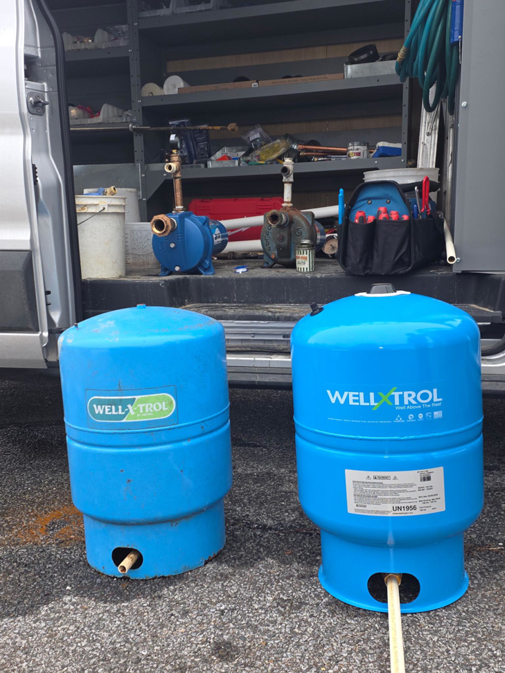 New and old well pressure tanks ready for installation or replacement by Fletchers Plumbing and Heating in Smyrna, DE