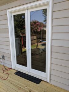 A new aluminum wheelchair ramp installed outside a mobile home by The Home Pros in Carson, CA.