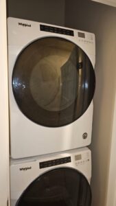 A stacked Whirlpool washer and dryer unit installed by Medina's Handyman LLC in Las Vegas, NV
