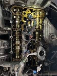 White kitchen cabinets with a newly installed over-the-range microwave by Camelback Cabinets in Gilbert, AZ
