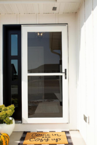A modern white storm door enhancing a home entryway, installed by Denver Storm Door in Denver, CO.