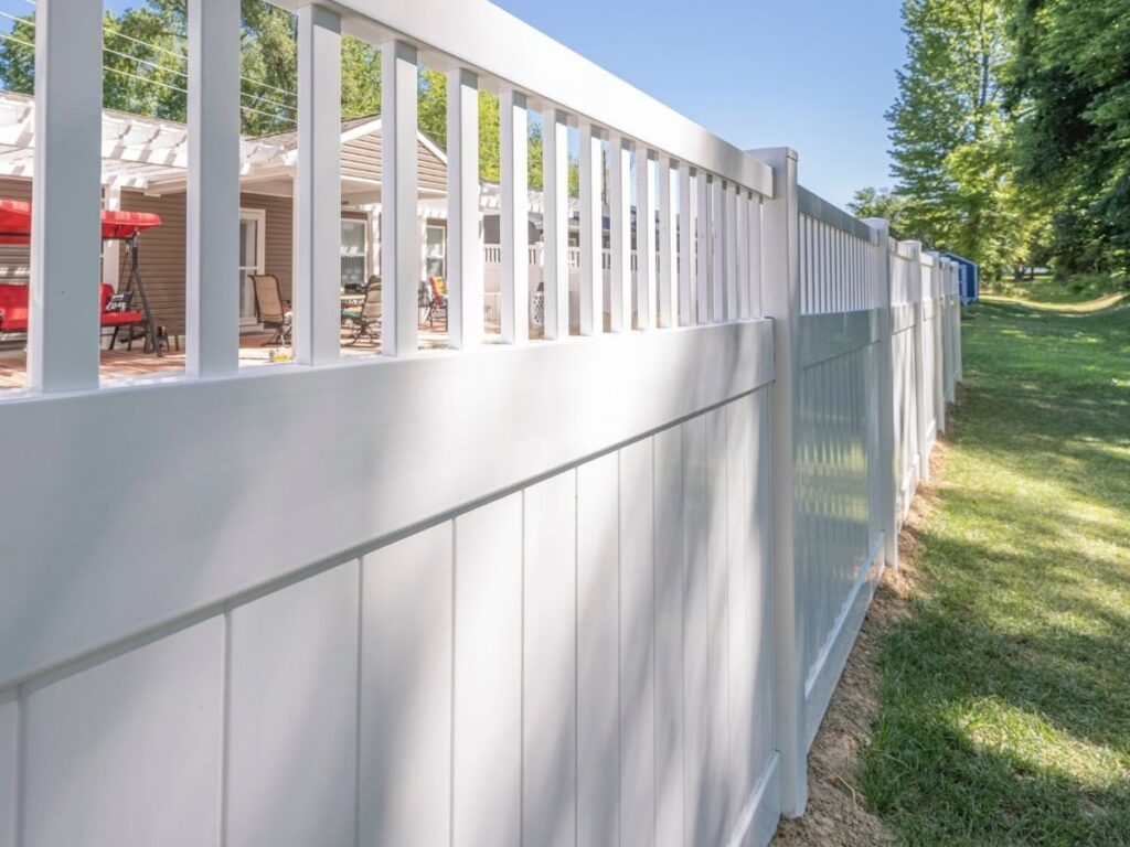A clean white vinyl privacy fence installed by Tin Star Fencing for a residential property in Fort Worth, TX