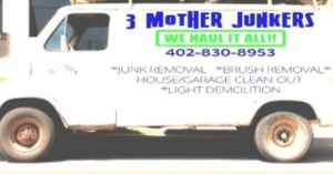 A white work van displaying the business name 3 Mother Junkers and their services in Omaha, NE.
