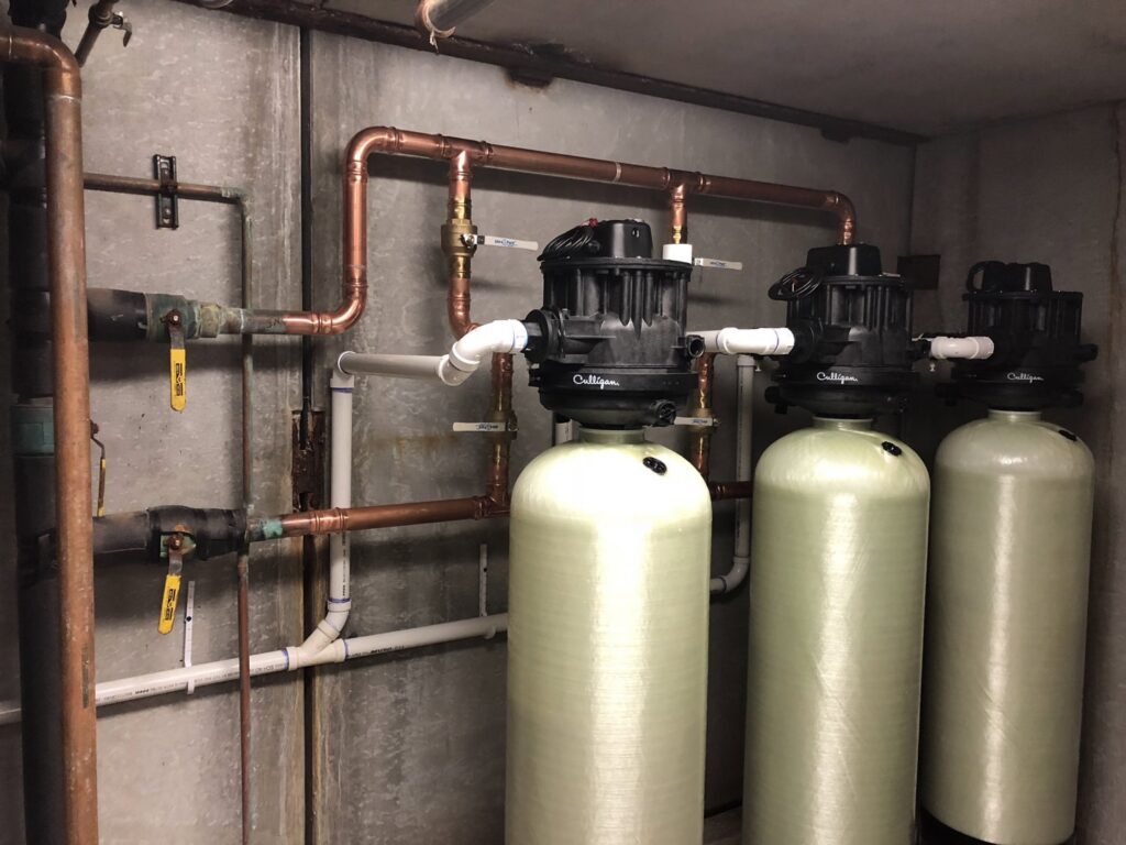 Whole-house water filtration system with copper piping installed by Northern Air Plumbing & Heating in Aitkin, MN