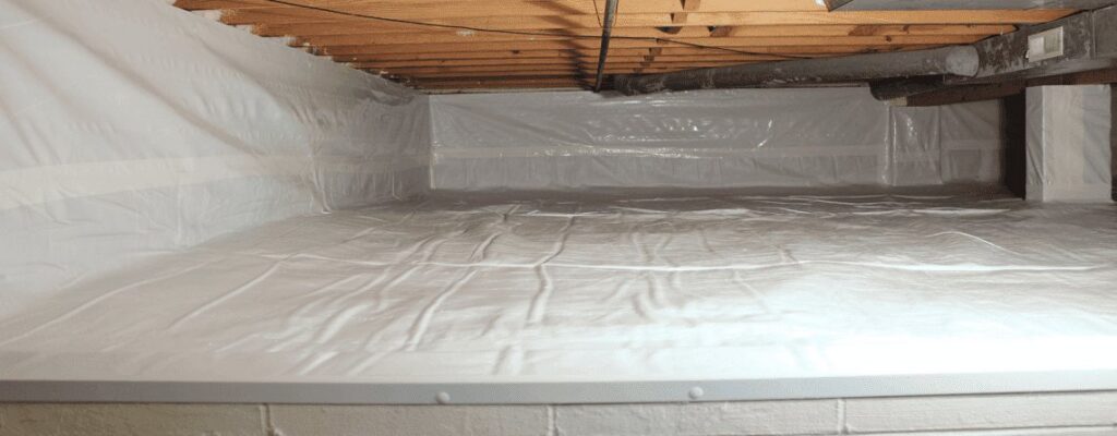 A wide view of a clean crawl space with white encapsulation installed by The Basement Doctor in Reynoldsburg, OH.