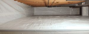 A wide view of a clean crawl space with white encapsulation installed by The Basement Doctor in Reynoldsburg, OH.