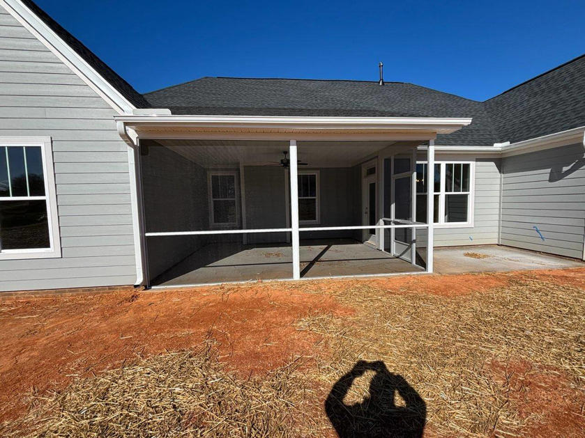 A wide exterior view of a newly constructed screened porch by AccampoBros Home Solutions in Greenville, SC.