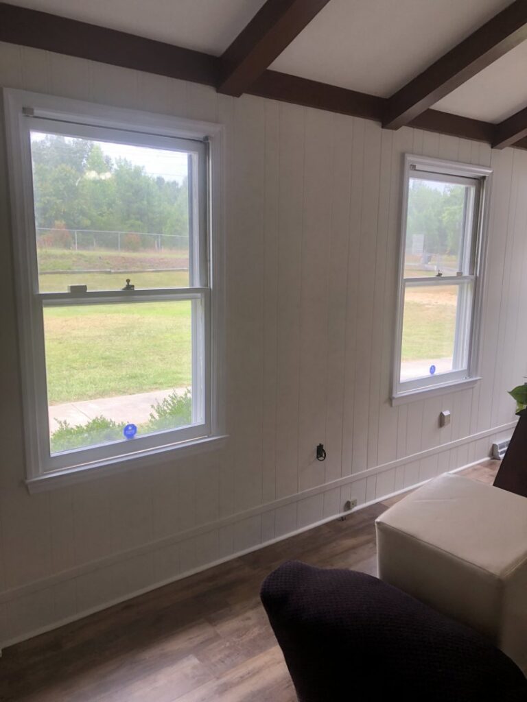 Interior room with new window and wall paneling installation by Lee's Painting in Northbrook, IL