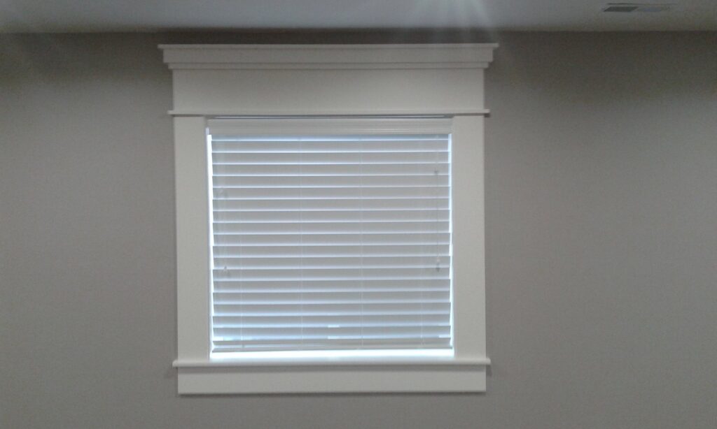 Newly installed window blinds and custom trim work by Eagle Rock Handyman Services in Caldwell, ID.