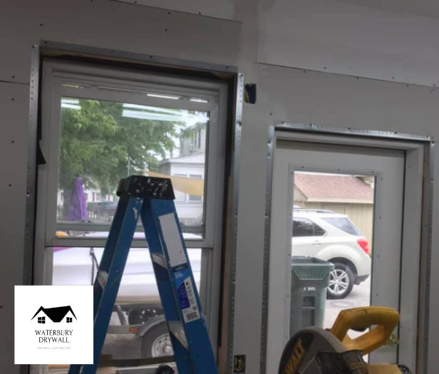 Window and door frames with metal corner beads installed, part of drywall work by Waterbury Drywall in Waterbury, CT.