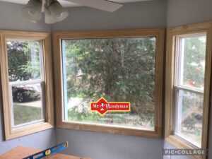 Newly installed window frames with a level tool on the table by Mr. Handyman of Waukesha and North Milwaukee County, WI.