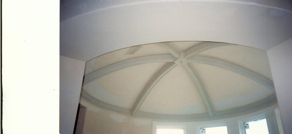 A newly installed window with blinds and ongoing drywall finishing, demonstrating services by Honeycomb Handyman Services in Salt Lake City, UT.