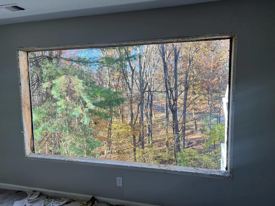 Large window opening during a replacement project, showcasing handyman services by Fox Solutions Corp in Worcester, MA