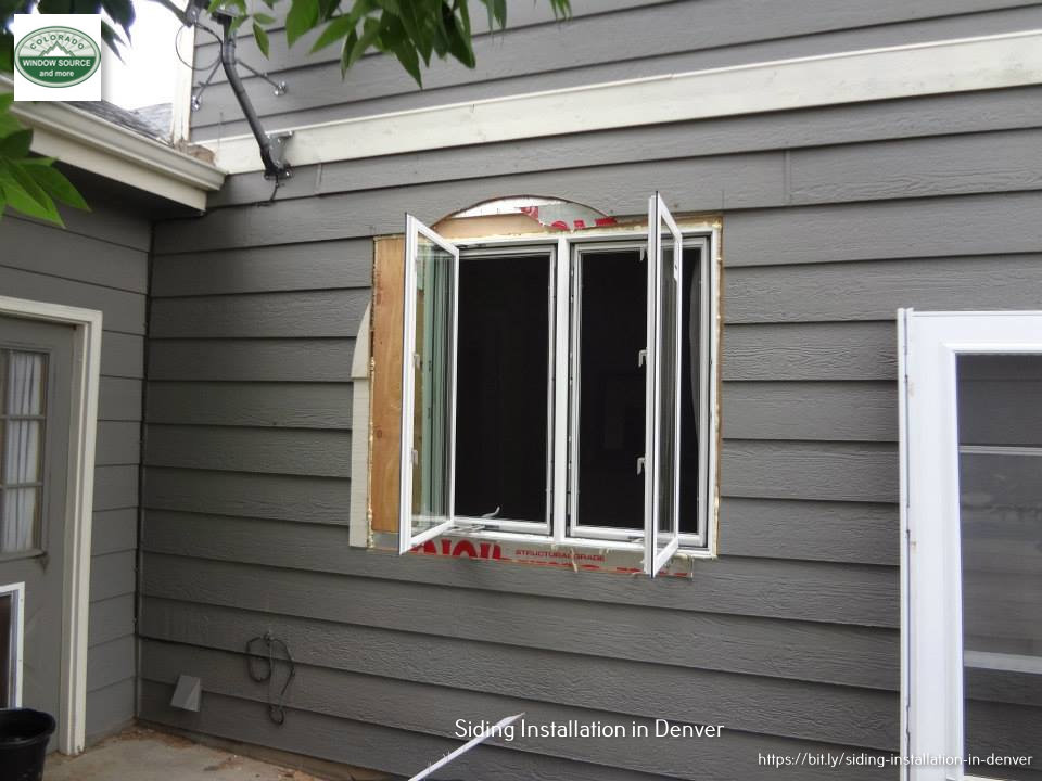 Window and siding installation in progress on a house by Colorado Window Solutions in Denver, CO.