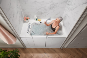 A woman enjoying a newly installed walk-in jetted bathtub by Pacific Bath in Portland, OR.