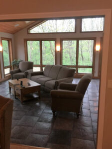 Two ceiling fans installed on a wooden patio ceiling by S. Brown Construction Co. in Lafayette, IN