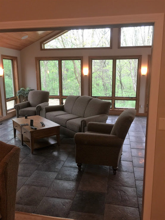 Two ceiling fans installed on a wooden patio ceiling by S. Brown Construction Co. in Lafayette, IN