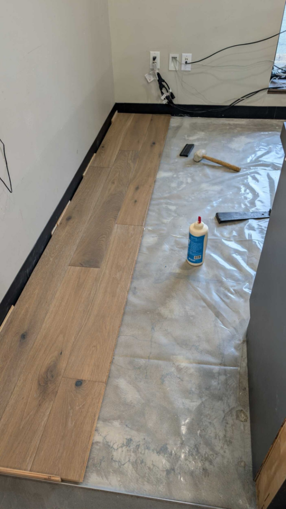 New wood flooring installation in progress by Carpet Hut by McDrake in Virginia Beach, VA.