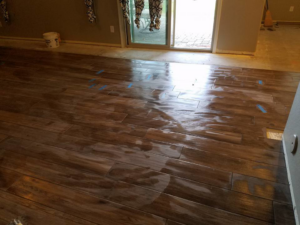A recently installed wood-look plank tile floor by Clayton Family Tile, LLC in Chandler, AZ