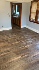 Newly installed wood-look vinyl plank flooring in a room by Creative Carpets in North Las Vegas, NV.