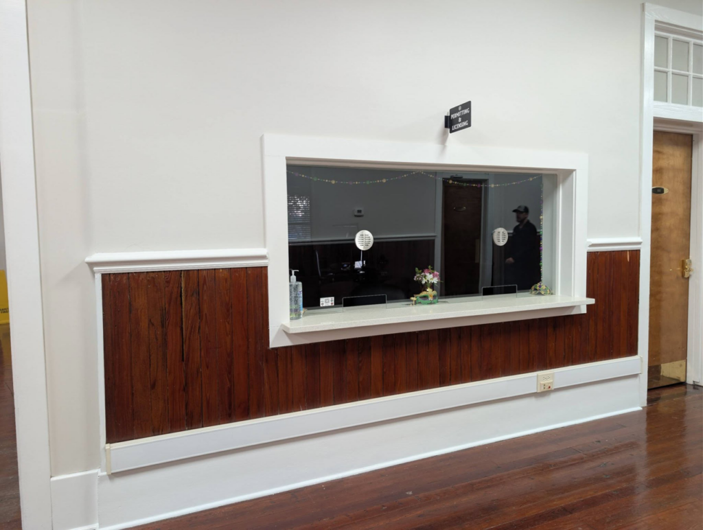 Professional installation of wood paneling and a service window by Bourque's Quality Construction, LLC in Lafayette, LA.