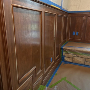 Wood paneling taped off and prepared for painting or staining by Rock Creek Renovation and Painting in Waynesville, OH